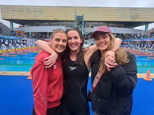 Emma Chelius with teammates Kaylene Corbett L and Erin Gallagher R